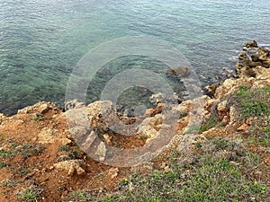 Clear sea bottom and sharpen rocky coastline