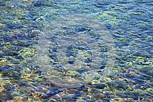 Clear sea water background. Transparent sea surface