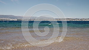 clear sea water on a beach closeup