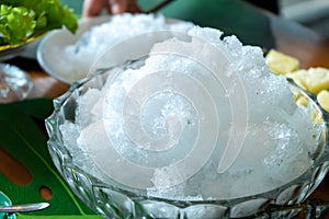 Clear Shave ice with out topping prepare for Thailand black jelly and syrup for dessert after lunch in the summer and hot weather