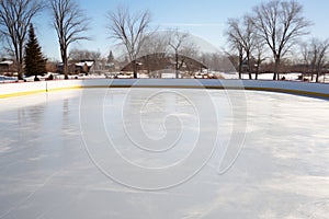 a clear shot of an unfilled outdoor ice-skating rink