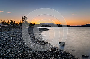 Clear Sky over a Deserted Rocky Beach at Dusk