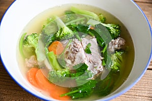 Clear Soup bowl with pork ribs  vegetable carrot broccoli soup and celery, Food healthy menu