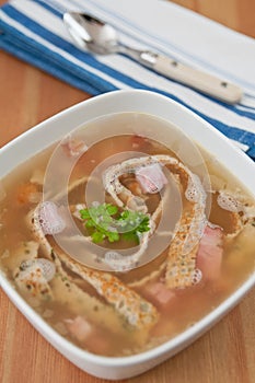 Clear soup with sliced pancakes