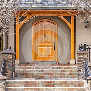 Clear Square Entryway of home framed with leafless hibernating trees on the yard in winter
