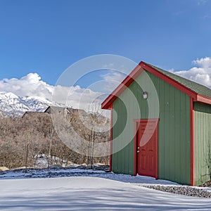 Clear Square Exterior of a wooden storage shed built on a snow covered ground in winter