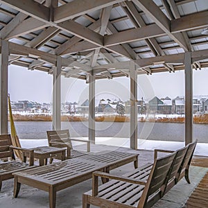 Clear Square Snowy patio of a clubhouse overlooking Oquirh Lake