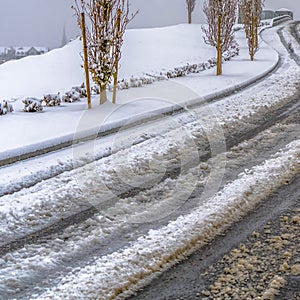 Clear Square Tracks on a snowy road in Daybreak during winter