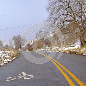 Clear Square Winter road with bicycle lane sign on the surface