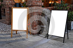 Clear street signage board placed by an outdoor dinning area of a restaurant.