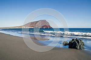 Clear sunny afternoon on the secluded, very private Tejita Beach, Tenerife, Canary Islands, Spain photo