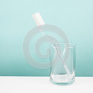 The clear toothbrush with small glass