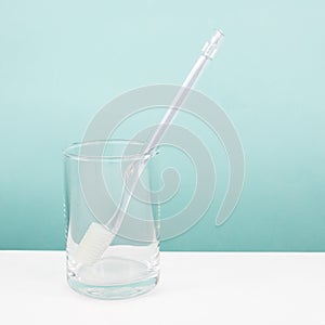 The clear toothbrush with small glass