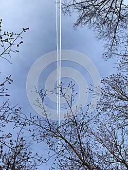 Clear traces of two planes in the blue sky on a clear day