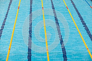 Clear transparent swimming pool water. Swim lanes in olympic swimming pool