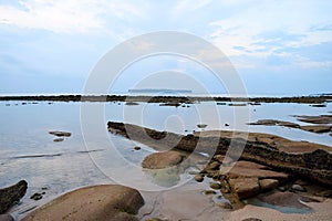 Clear Transparent Water at Coastline with Morning Blue Sky with Abstract Shapes in Soil