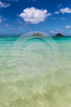 Clear turquoise water and two islands view at Lanikai beach, Oahu