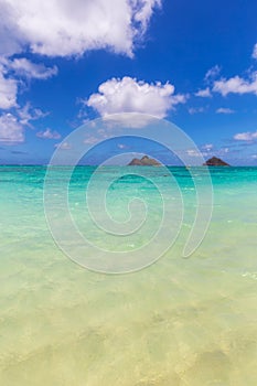 Clear turquoise water and two islands view at Lanikai beach, Oahu