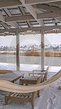 Clear Vertical Clubhouse overlooking Oquirrh Lake in winter day