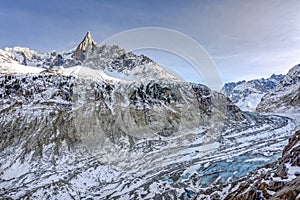 Clear view of Aiguille du Dru with glaicer and ice cave at the bottom near Chamonix, French Alps