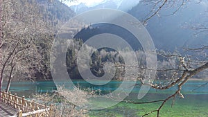 Clear view of blue crisp water of beautiful lake with mountain scene