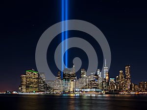 Clear view from Brooklyn of 911 memorial tribute light in Manhattan, New York City photo