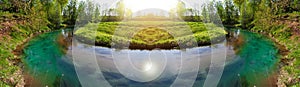 Clear water and beautiful water source in river forest at the spring or summer sunny day. Panorama.