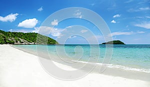 Clear water and blue sky on tropical sandy beach at summer sunny