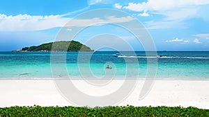 Clear water and blue sky on tropical sandy beach at summer sunny