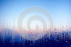 Clear water drops on the glass window. Background.