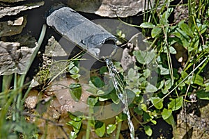 Clear water flows from a pipe