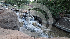 Clear water flows in a small waterfall in the Kurdish spring