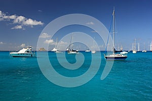 Clear water, island, boats and yachts