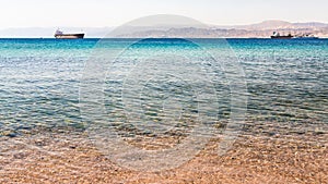 Clear water near urban beach of Aqaba town