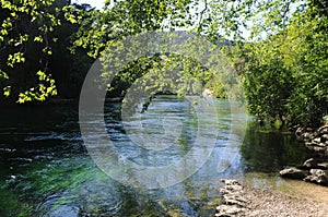 Sorgue river in Fontaine de Vaucluse in Provence, France photo