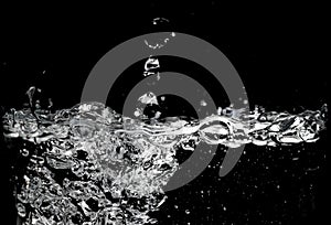 Clear water surface on a black with ripple and bubbles photo