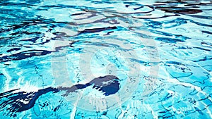 Clear water surface. Blue wave texture, pool water background. Abstract summer sea pattern.