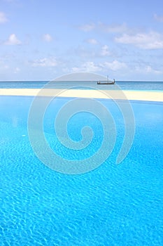 Clear water in the swimming pool on the beach