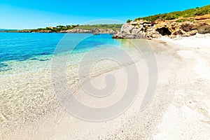 clear water and white sand in Alghero shore