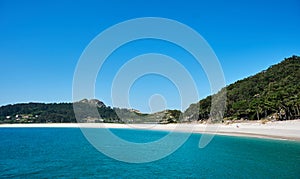 Clear water and white sand beach in Cies Islands photo