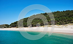 Clear water and white sand beach in Cies Islands photo