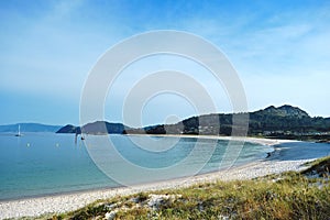 Clear water and white sand beach in Cies Islands photo