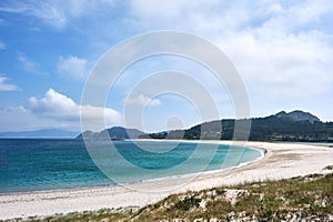 Clear water and white sand beach in Cies Islands photo