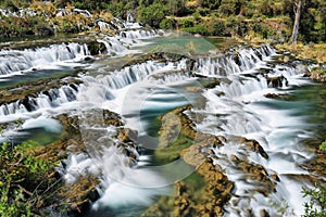 Clear waters of CaÃÂ±ete river in Huancaya village, Peru photo