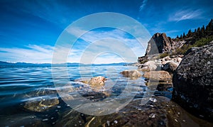 Clear Waters of Lake Tahoe California a Large Lake surrounded by gorgeous mountains photo