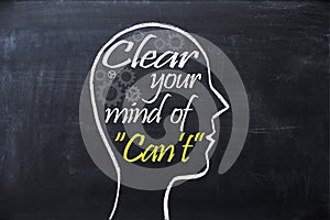 Clear your mind of can`t phrase inside human head shape drawn on chalkboard photo