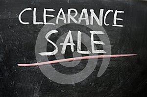 Clearance sale written on a blackboard photo