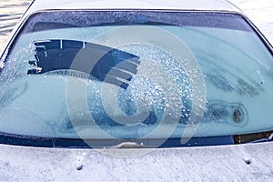 Cleared the frost on the windshield in the cold, front and rear blurring the background
