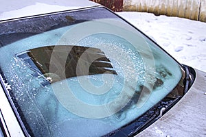 Cleared the frost on the windshield in the cold, front and rear blurring the background