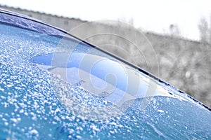 Cleared the frost on the windshield in the cold, front and rear blurring the background